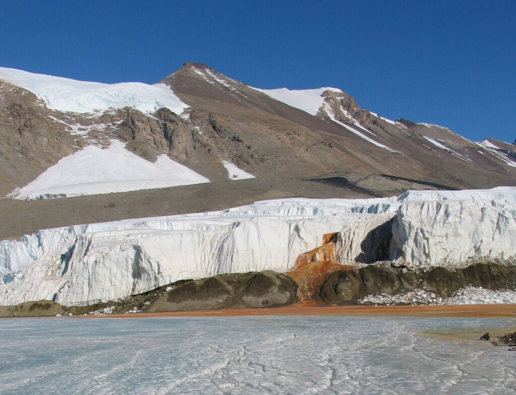 Red liquid leaking out of the ice in Blood Falls at the South Pole